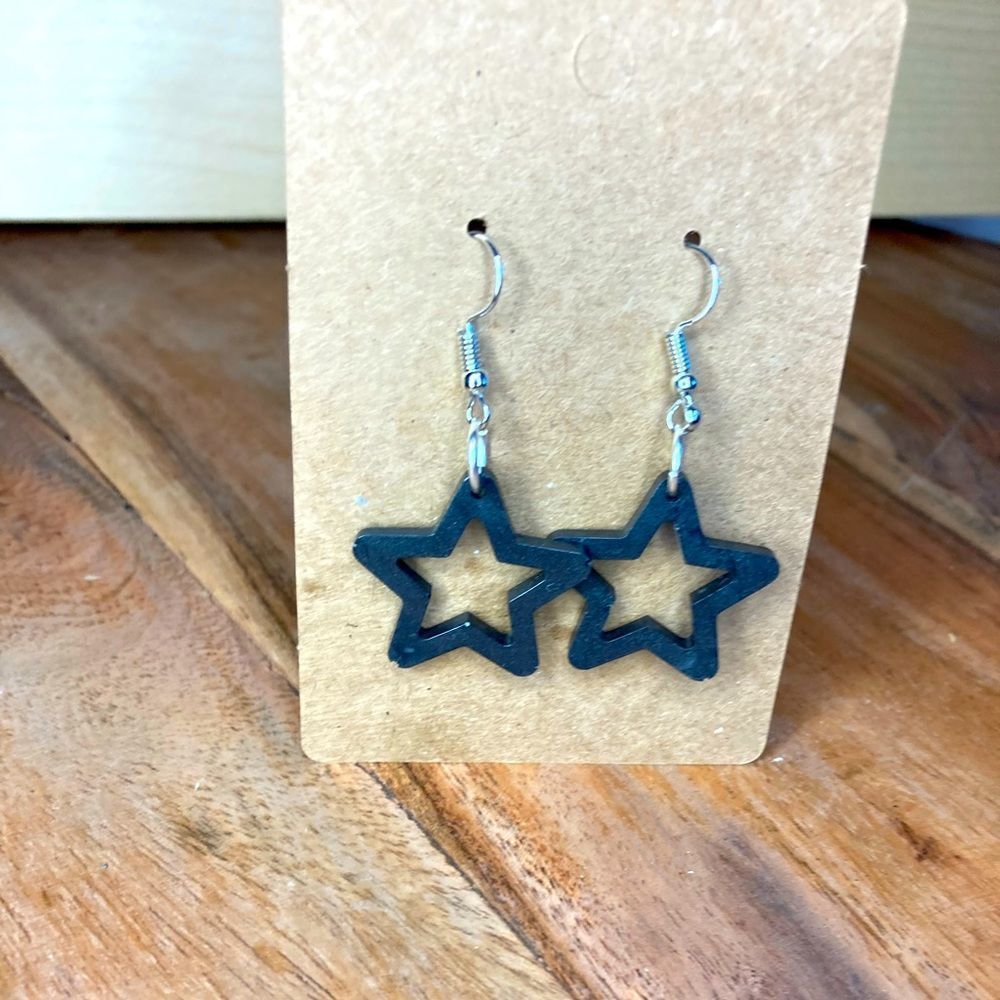 Black star dangling earrings